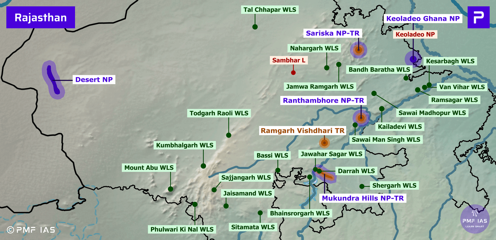 Map of Rajasthan highlighting national parks (NP), tiger reserves (TR), and wildlife sanctuaries (WLS) with color-coded labels: purple for national parks, red for tiger reserves, and green for wildlife sanctuaries. Key protected areas such as Ranthambhore NP-TR, Sariska NP-TR, and Mukundra Hills NP-TR are prominently marked, showing distribution and concentration of conservation zones across the state. Map of Rajasthan highlighting national parks (NP), tiger reserves (TR), and wildlife sanctuaries (WLS) with color-coded labels: purple for national parks, red for tiger reserves, and green for wildlife sanctuaries. Key protected areas such as Ranthambhore NP-TR, Sariska NP-TR, and Mukundra Hills NP-TR are prominently marked, showing distribution and concentration of conservation zones across the state.